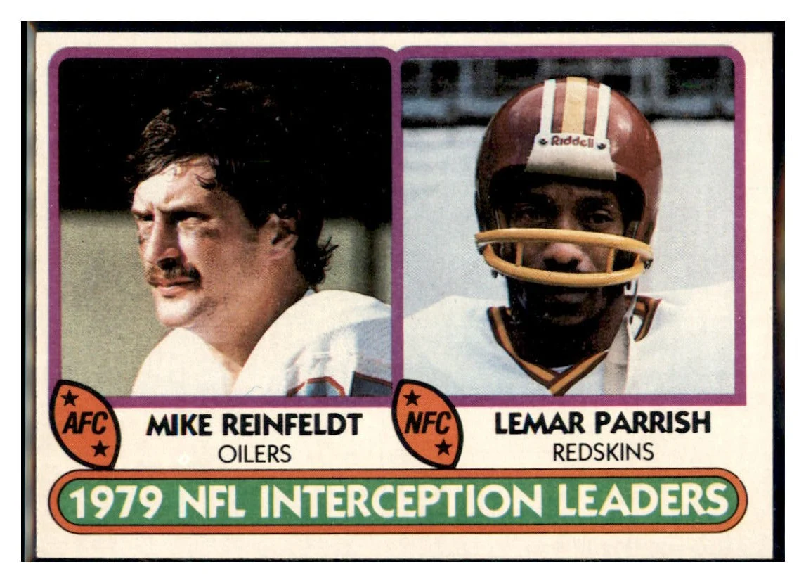 1980 Topps 1979 InterceptionLeaders - Mike Reinfeldt / Lemar Parrish LL Houston Oilers / Washington Commanders Football Card VFBMC