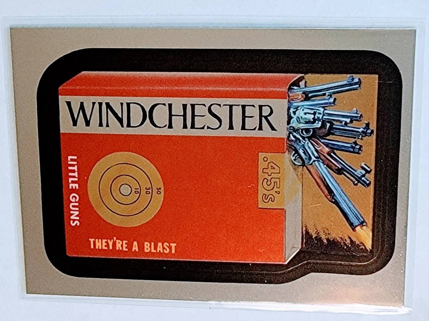 2014 Wacky Packages Chrome Winchester Little Guns Sticker Trading Card MCSC1